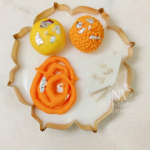 mithai platter lotus urli, 5.5 inch sweet platter, festive urli mithai gift, laddu peda jalebi kaju katli, Diwali sweet gift box, Indian sweets in urli, lotus urli mithai tray, traditional sweet platter, Rakhi gift sweets, housewarming mithai bowl