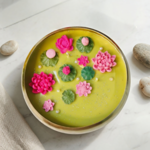 golden lotus urli candle, soy wax urli candle, 3-wick urli candle, hand-poured lotus candle, luxury candle for Diwali, eco-friendly urli candle, meditation soy candle, urli bowl candle gift, rose scented urli candle, decorative lotus candle